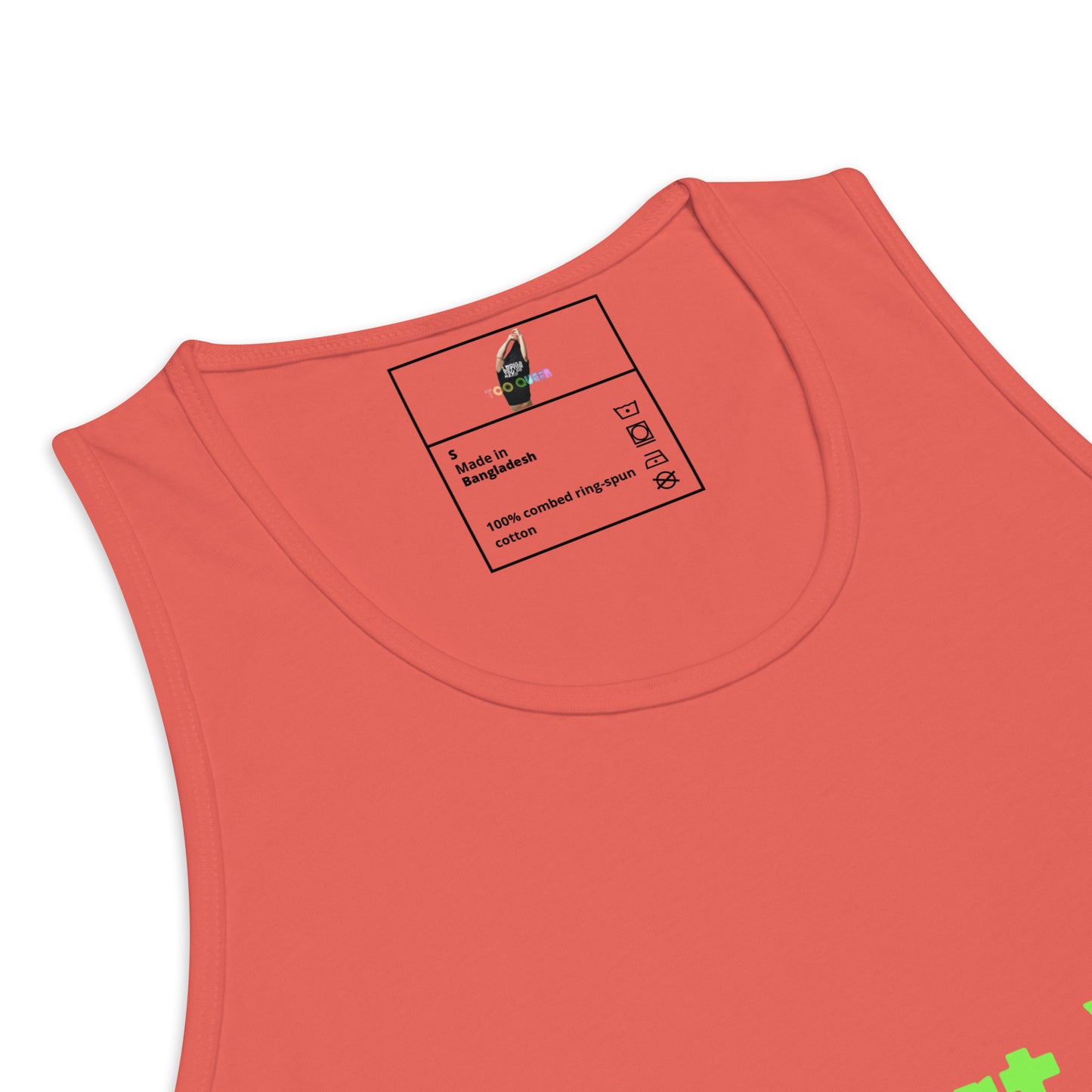 Close-up of a sleeveless tank top in a coral pink color, showing the inner neck label with text and a small graphic.