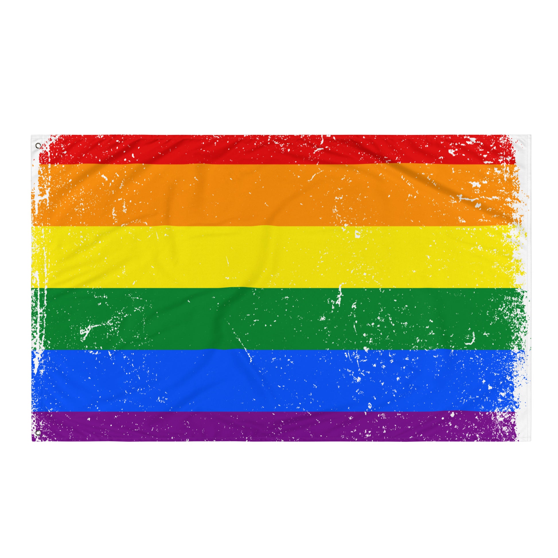 A rectangular rainbow pride flag with horizontal red, orange, yellow, green, blue, and purple stripes, shown flat against a plain white background. The fabric has a distressed, weathered texture with faded white speckling.