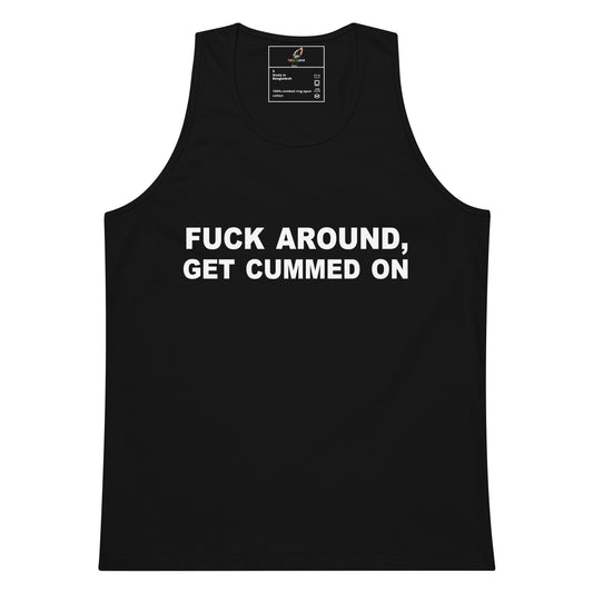 A black sleeveless tank top with bold white text on the front reading 'FUCK AROUND, GET CUMMED ON'. The tank top is displayed flat against a solid white background, with a brand label visible inside the collar.