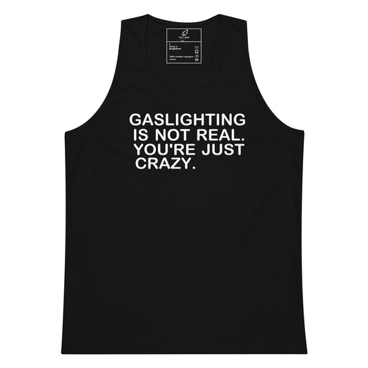 A black sleeveless tank top with bold white text on the front that reads, 'GASLIGHTING IS NOT REAL. YOU'RE JUST CRAZY.