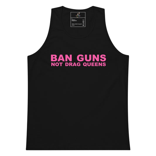 A black sleeveless tank top with the slogan 'BAN GUNS NOT DRAG QUEENS' printed in bright pink across the chest, shown on a plain white background.