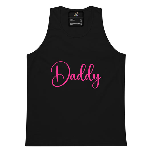A black sleeveless tank top with the word 'Daddy' printed across the chest in bright pink cursive script, shown on a plain white background.