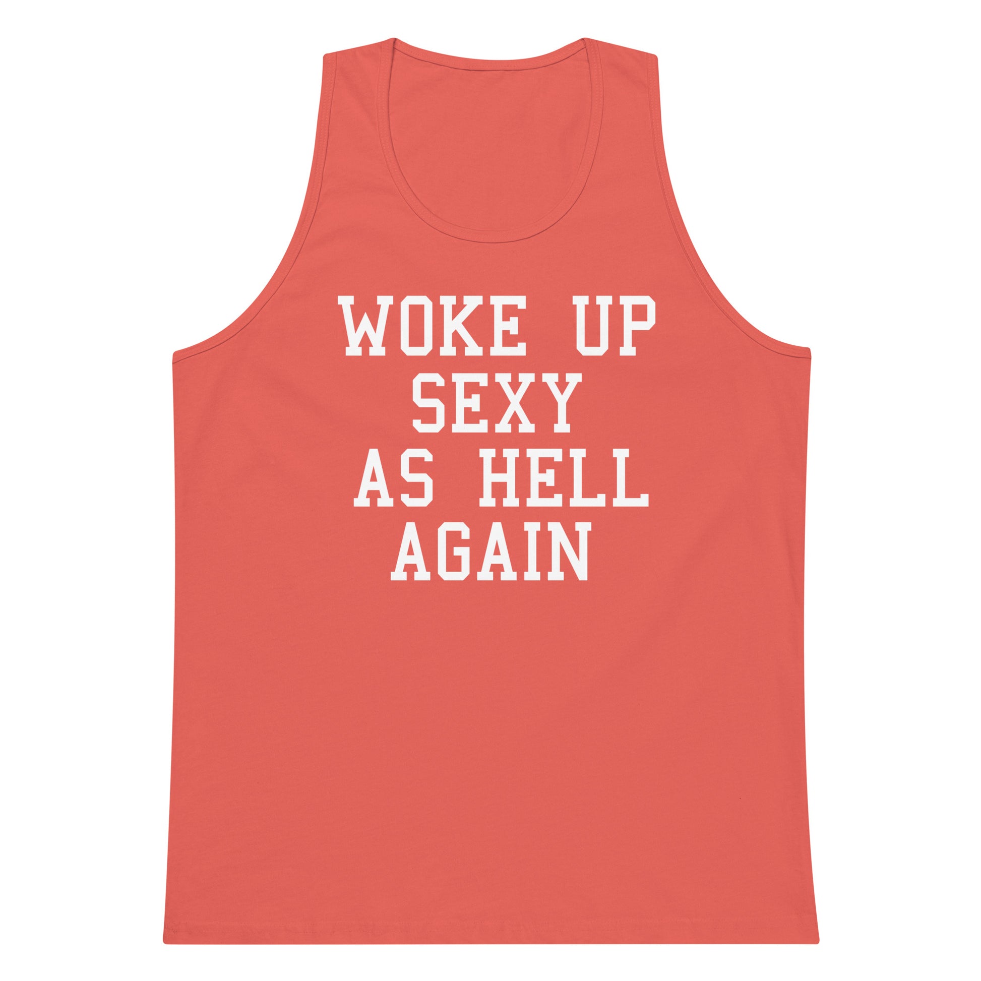 A coral pink tank top with bold white text reading 'WOKE UP SEXY AS HELL AGAIN' printed on the front, shown against a plain white background.