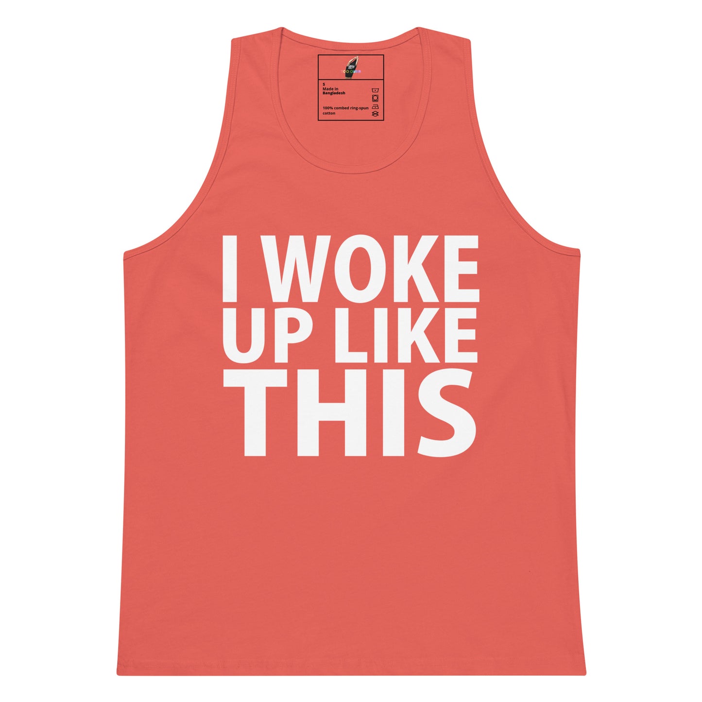 A coral pink sleeveless tank top with the phrase 'I WOKE UP LIKE THIS' printed in bold white capital letters across the front, shown on a plain white background.