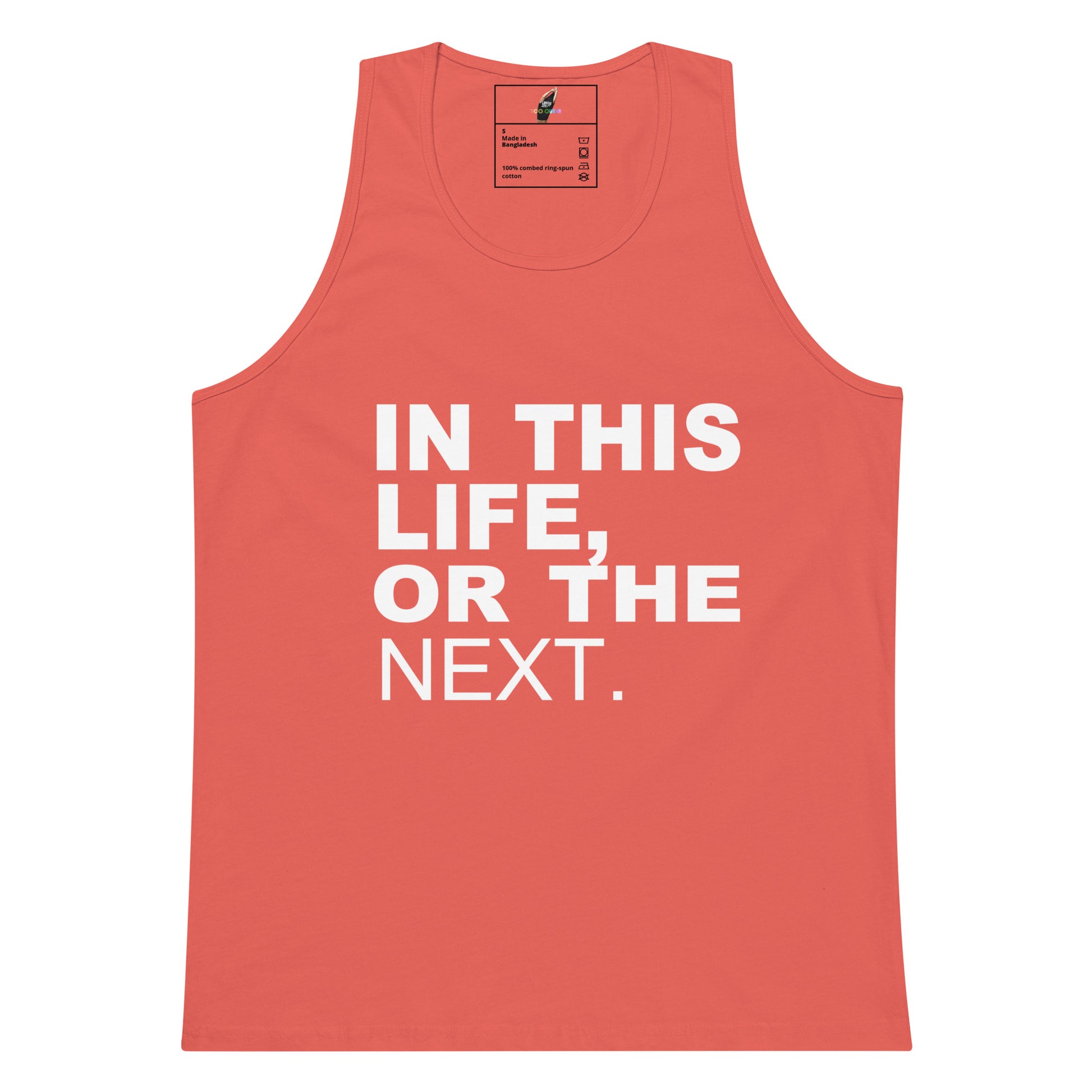 A coral pink tank top with bold white text reading 'IN THIS LIFE, OR THE NEXT.' on the front, shown flat against a white background.