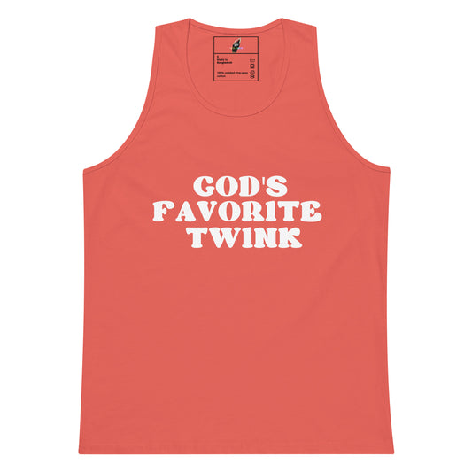 A coral pink sleeveless tank top with the phrase 'GOD'S FAVORITE TWINK' printed in bold white capital letters across the chest, displayed flat against a solid white background.