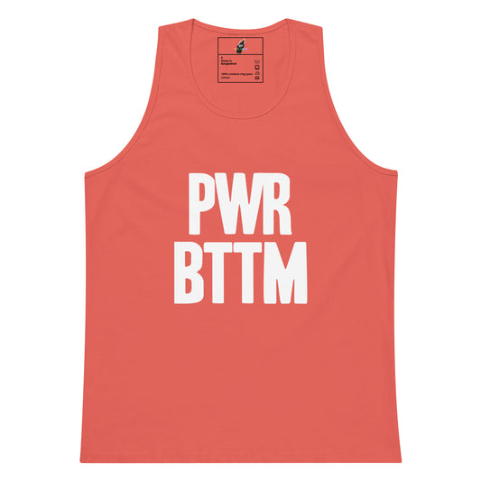 A coral pink sleeveless tank top with bold white text reading 'PWR BTTM' on the front, shown flat against a plain white background.