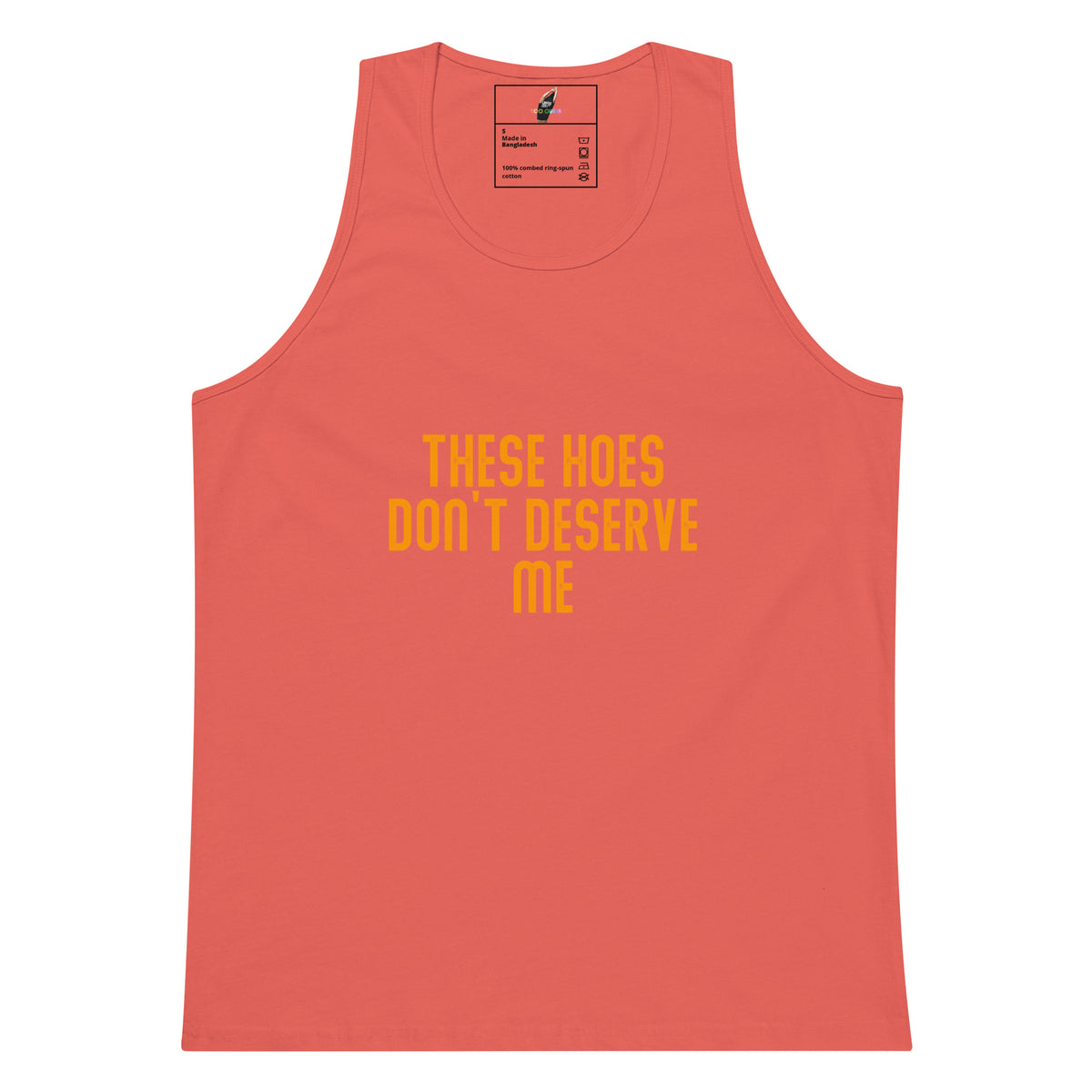 A coral pink tank top with yellow text on the front that reads 'THESE HOES DON'T DESERVE ME'. The tank top is displayed flat against a solid white background.