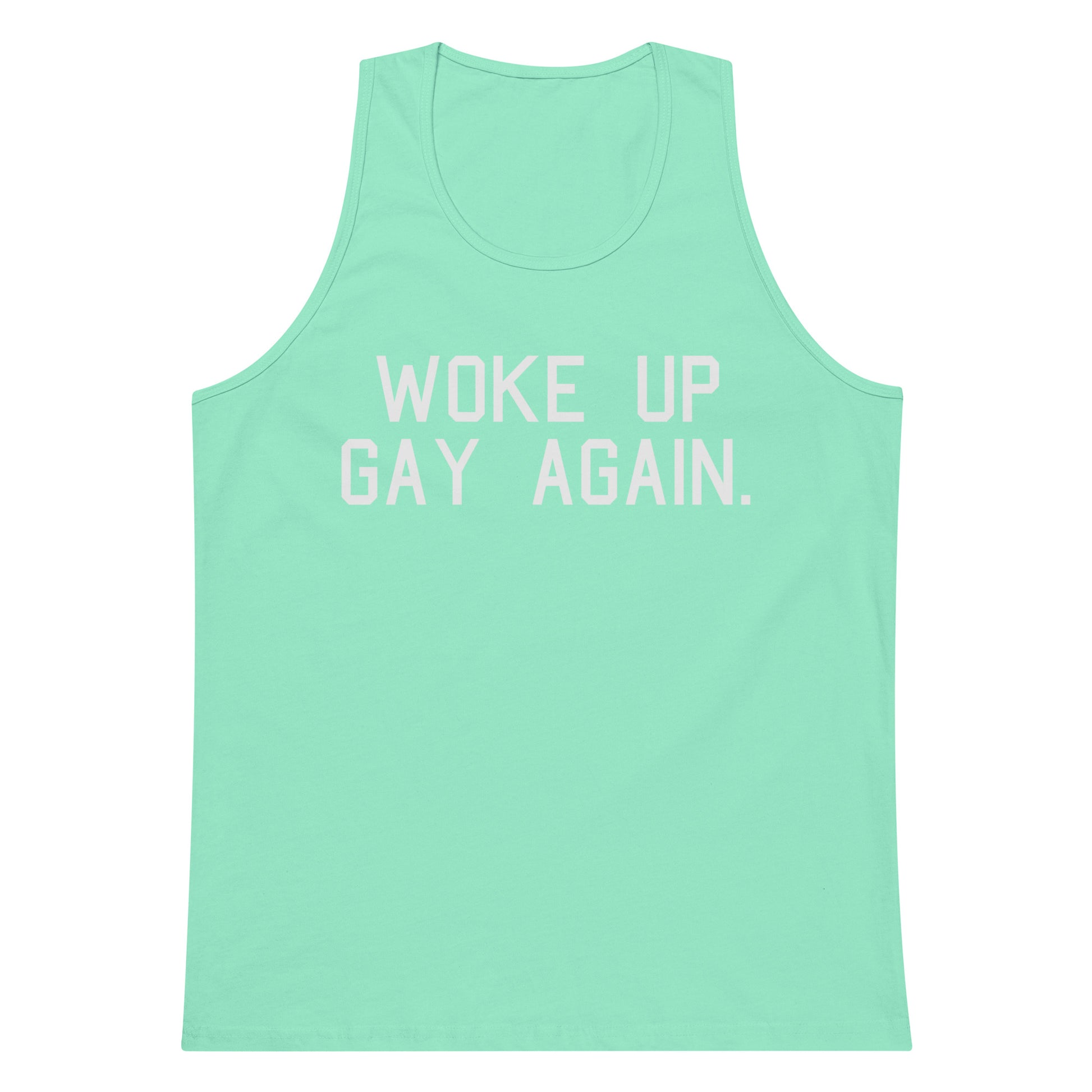 A mint green tank top with the phrase 'WOKE UP GAY AGAIN.' printed in white block letters across the chest, displayed on a solid white background.