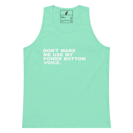 A mint green sleeveless tank top with white printed text on the chest reading 'DON'T MAKE ME USE MY POWER BOTTOM VOICE.' shown flat against a white background.
