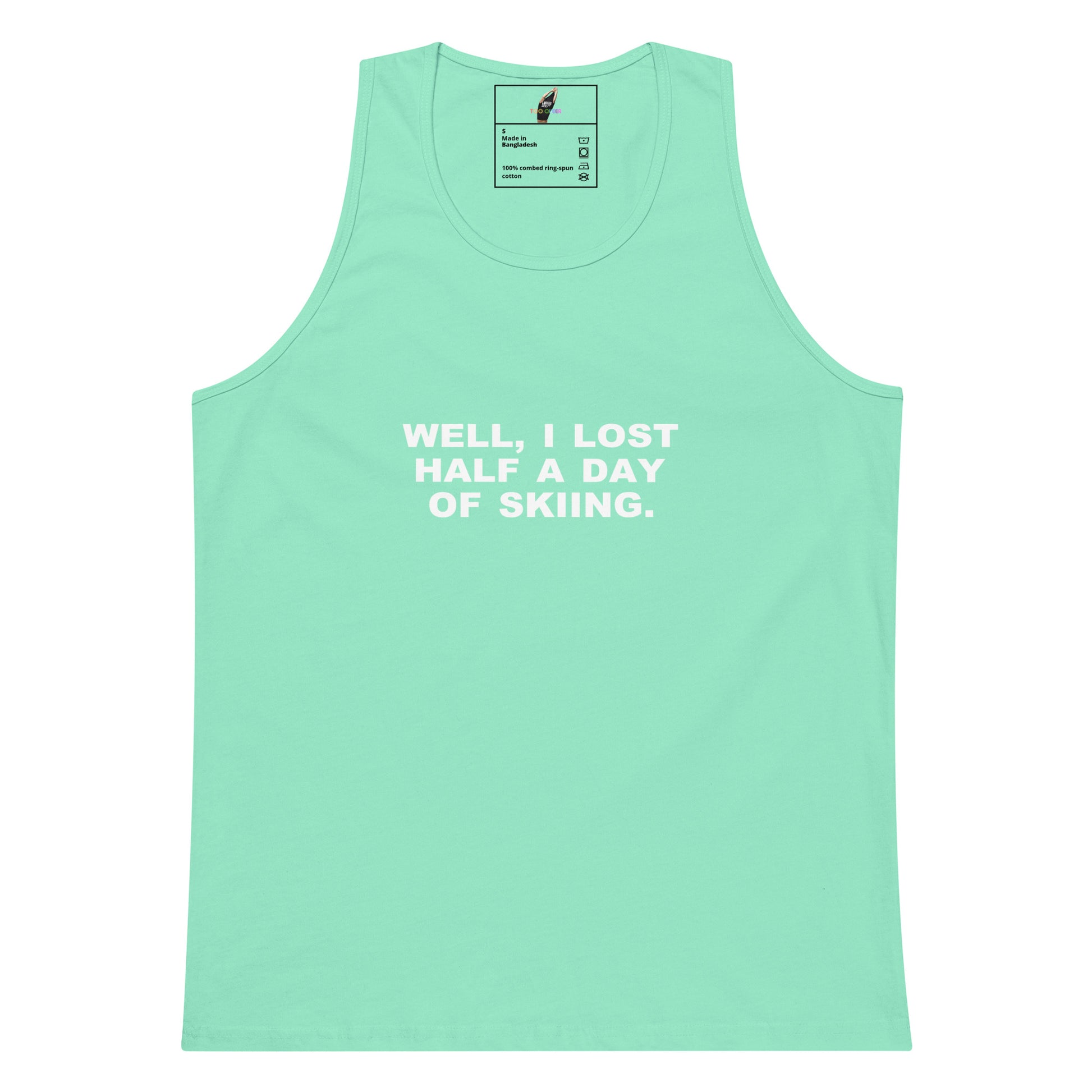 A mint green sleeveless tank top with white printed text on the chest reading 'WELL, I LOST HALF A DAY OF SKIING.' on a plain white background.