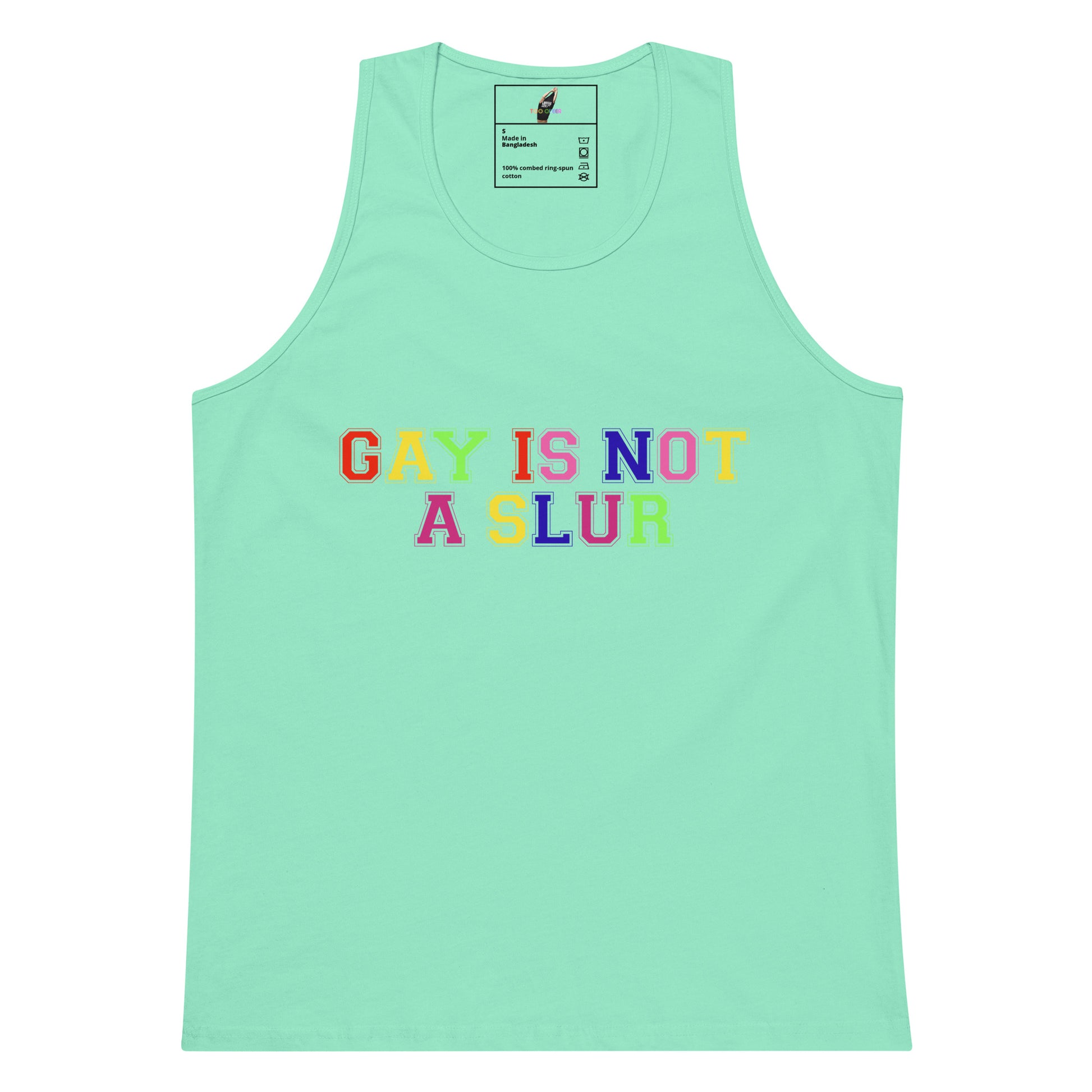 A mint green tank top with the text 'GAY IS NOT A SLUR' printed across the chest in a colorful, pixelated font. The shirt is displayed flat against a solid white background.