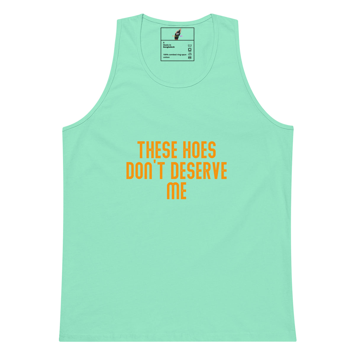A mint green tank top with the text 'THESE HOES DON'T DESERVE ME' printed in orange across the chest, displayed on a solid white background.