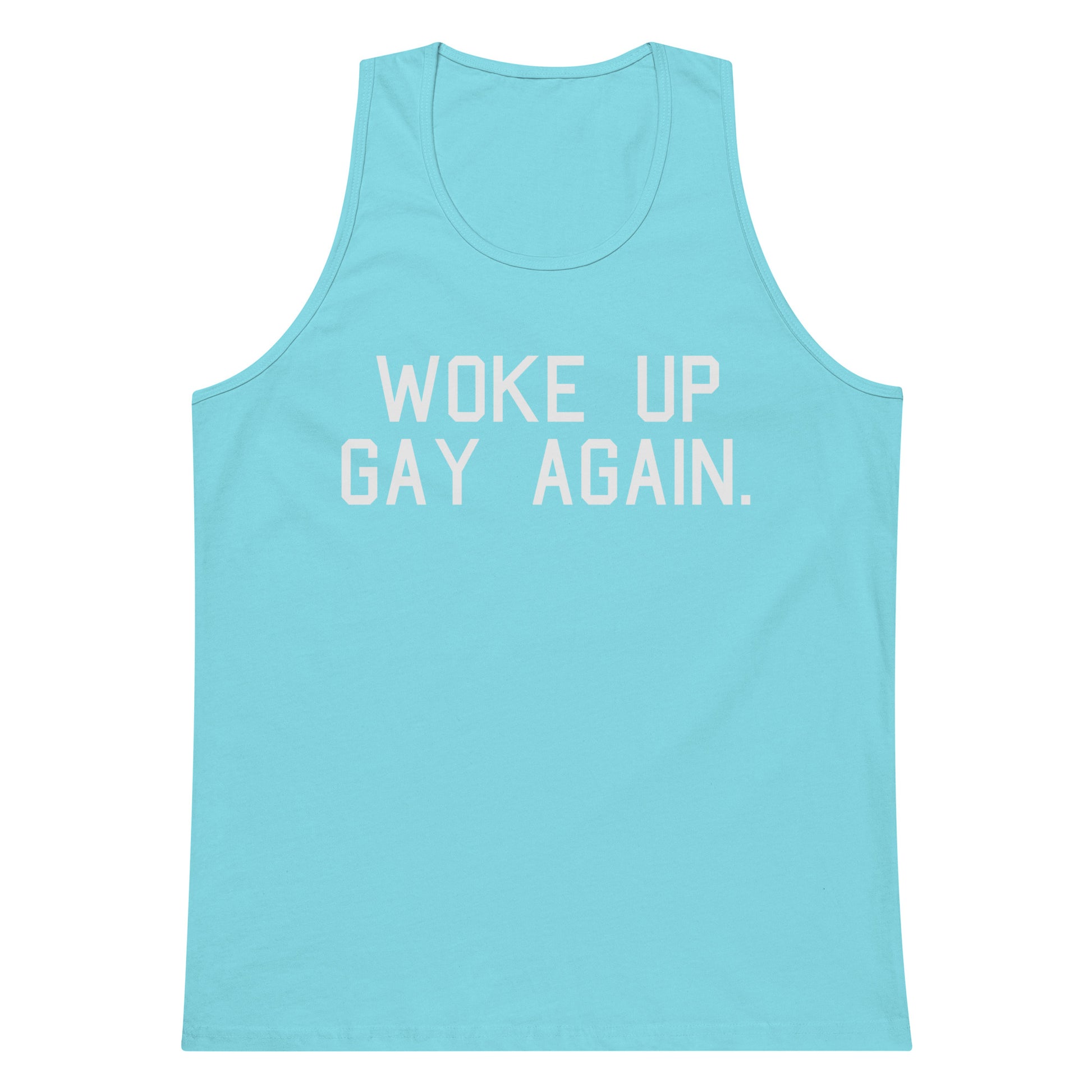 A light blue tank top with the phrase 'WOKE UP GAY AGAIN.' printed in white block letters across the chest, displayed on a solid white background.