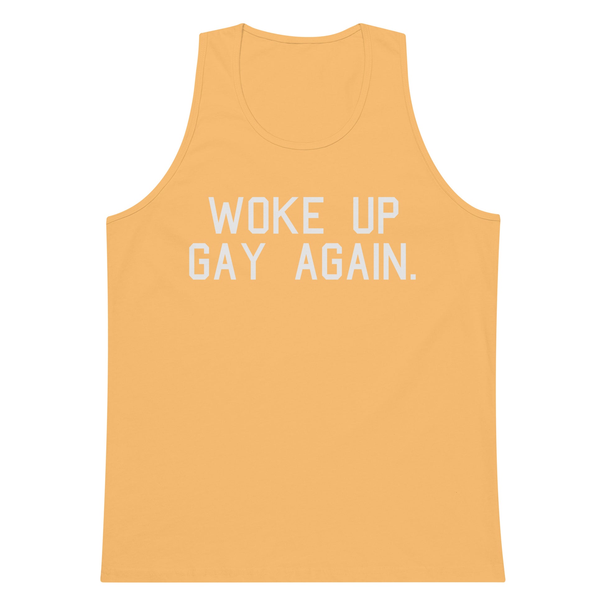 A yellow-orange tank top with the phrase 'WOKE UP GAY AGAIN.' printed in white block letters across the chest, shown on a plain white background.
