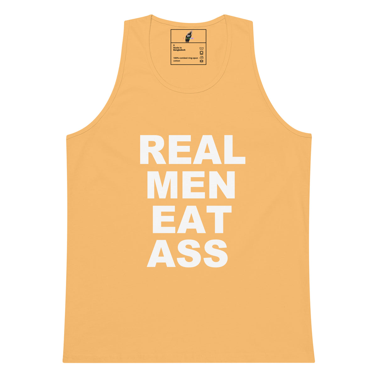 A light peach-colored tank top with the phrase 'REAL MEN EAT ASS' printed in bold white capital letters on the front, displayed against a solid white background.