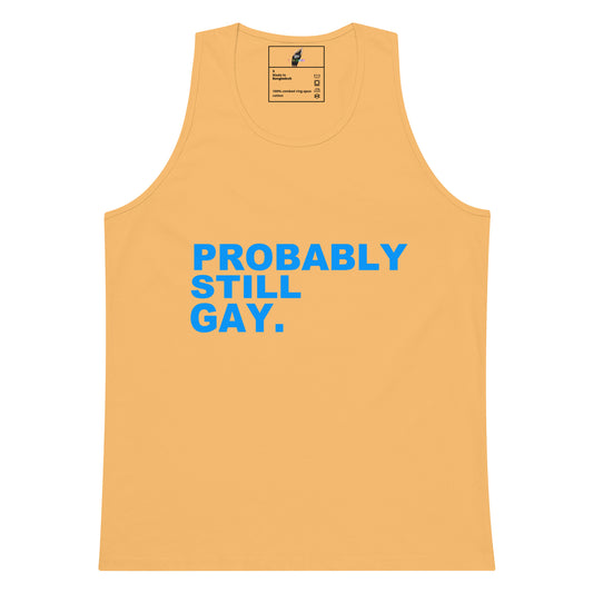 A light peach-colored tank top with the text 'PROBABLY STILL GAY.' printed in bold blue letters on the front, displayed against a solid white background.