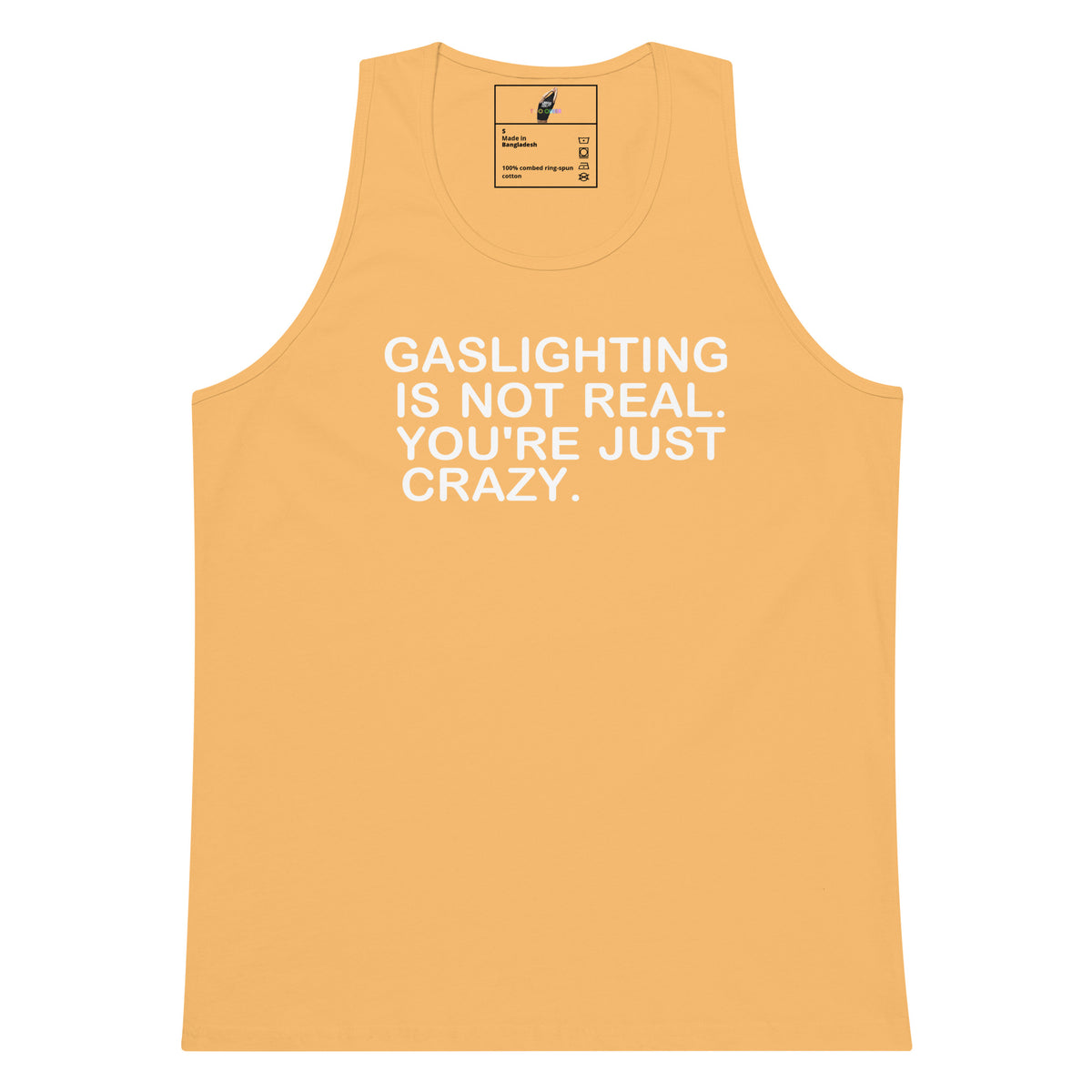 A light peach-colored tank top with bold white text on the front that reads 'GASLIGHTING IS NOT REAL. YOU'RE JUST CRAZY.