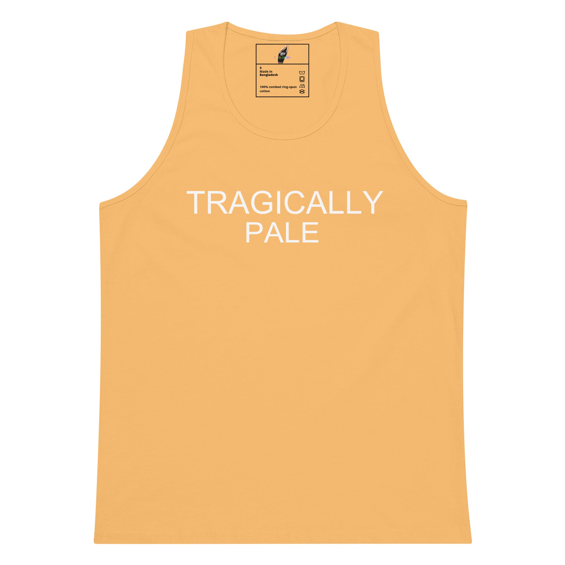 A light peach-colored tank top with 'TRAGICALLY PALE' printed in white across the chest, displayed flat against a solid white background.