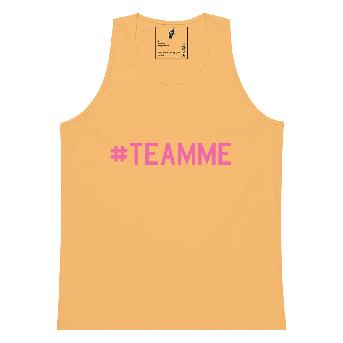 A light peach-colored tank top with the text '#TEAMME' printed in pink across the chest, displayed flat against a solid white background.