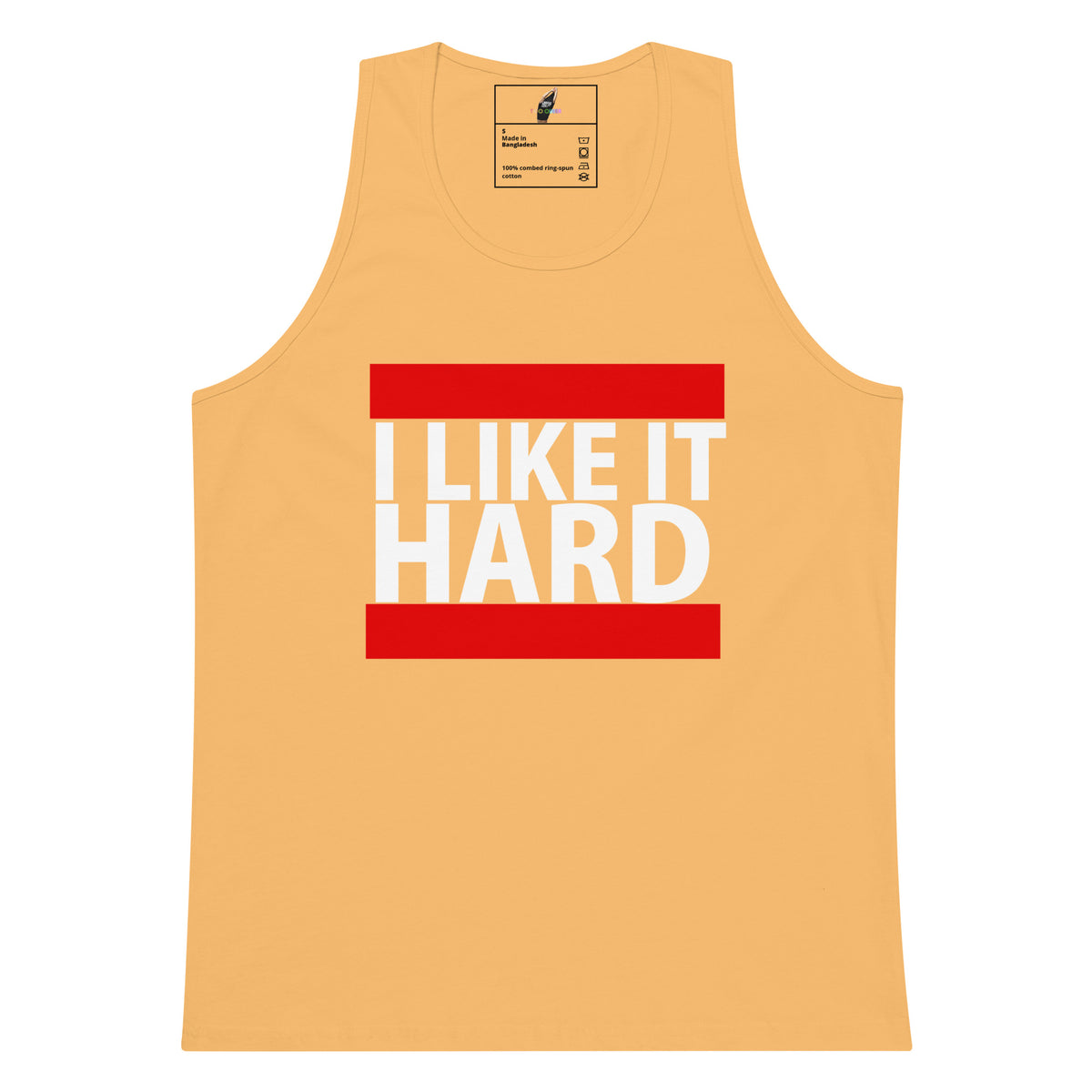 A light peach-colored tank top with a graphic on the chest reading 'I LIKE IT HARD' in bold white letters, framed by two horizontal red bars. The brand 'Bella+Canvas' is visible on the inner neck label.