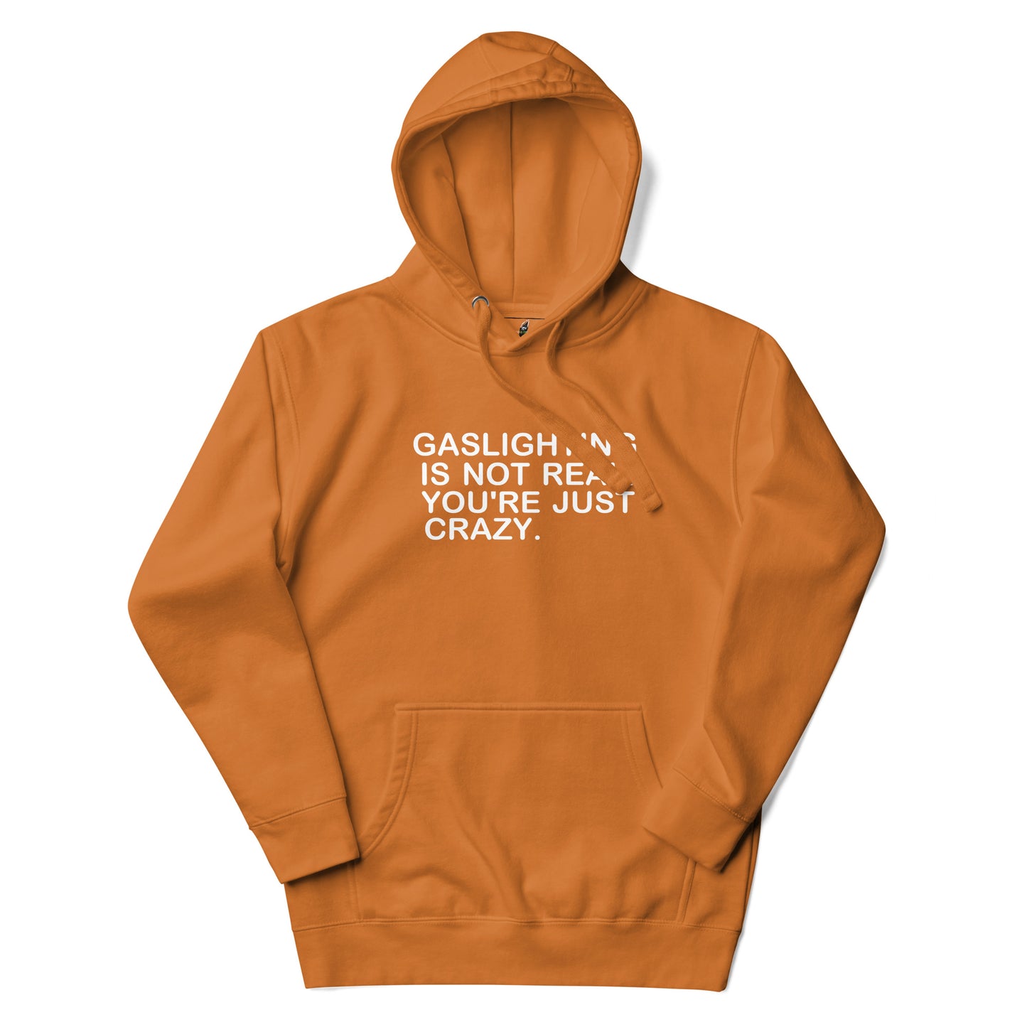 An orange pullover hoodie with white text on the chest reading 'GASLIGHT "N" IS NOT REAL. YOU'RE JUST CRAZY.