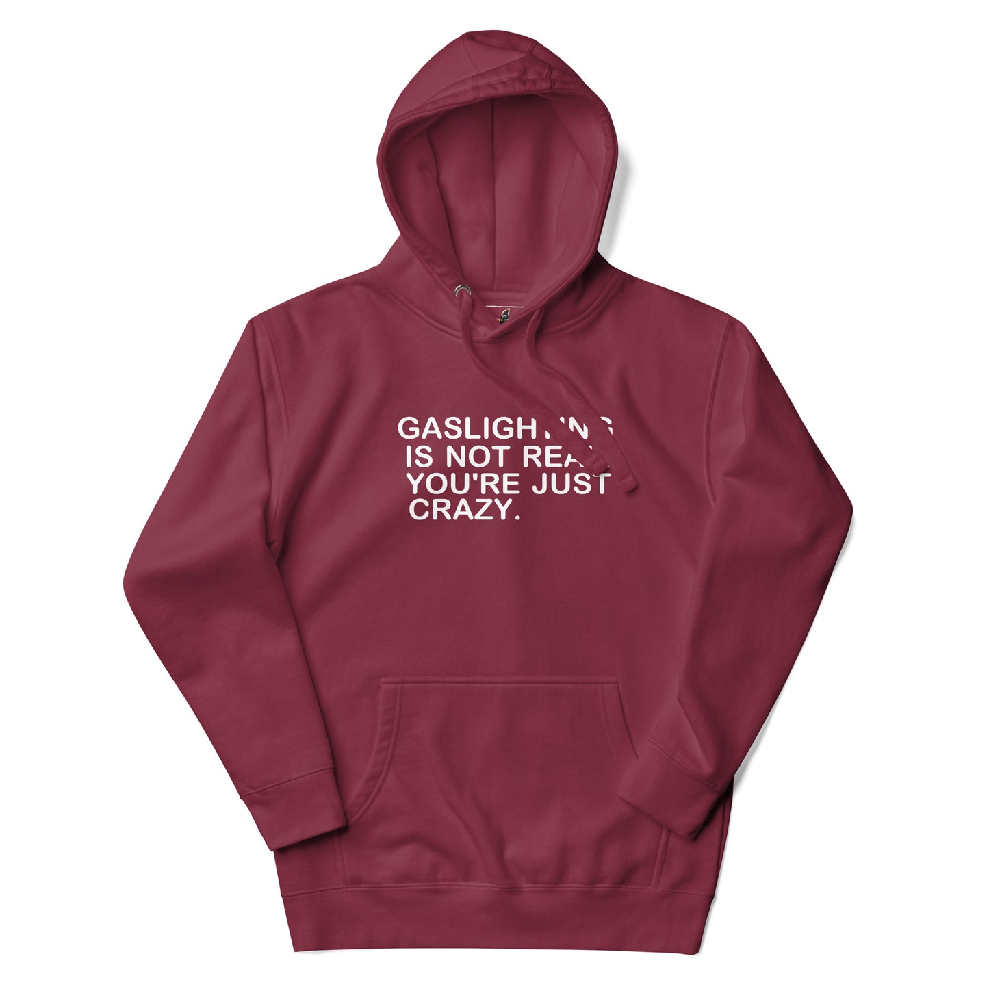 A maroon pullover hoodie with white text on the chest reading 'GASLIGHT "N" IS NOT REAL. YOU'RE JUST CRAZY.