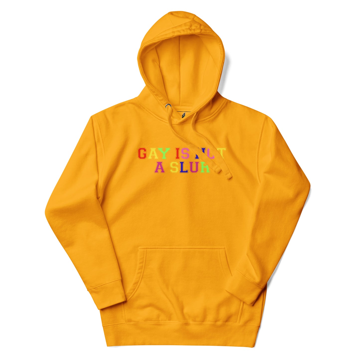 A mustard yellow pullover hoodie with the text 'GAY IS NOT A SLUR' printed across the chest in a rainbow-colored bubble font, displayed on a clean white background.