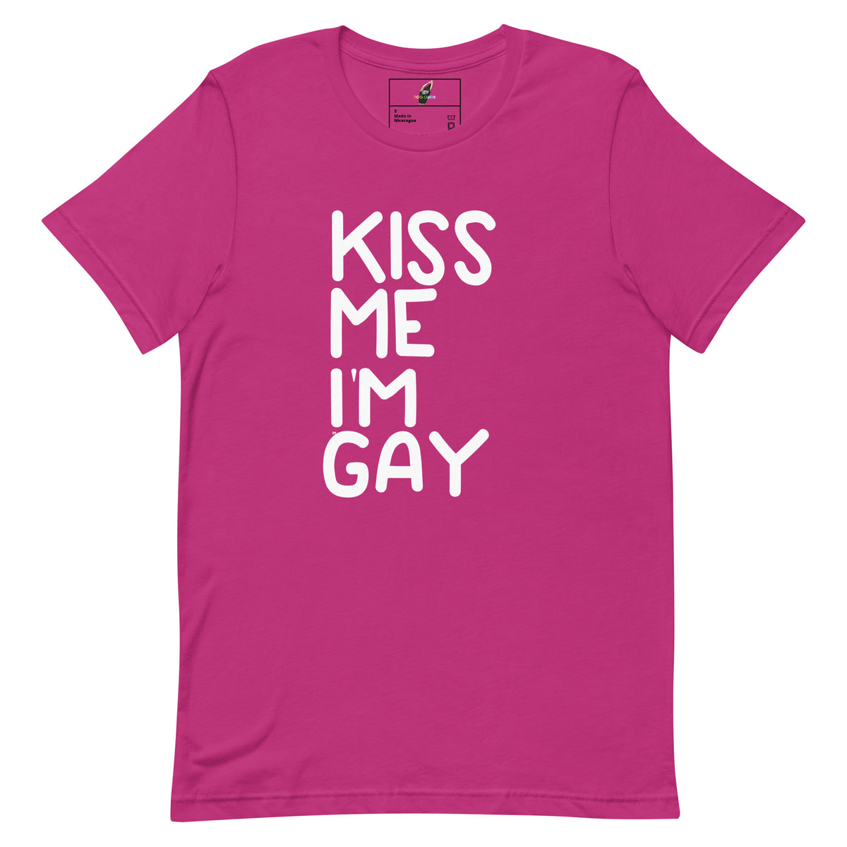 A bright pink short-sleeve crewneck t-shirt with the phrase 'KISS ME I'M GAY' printed vertically in bold white letters on the front, displayed on a clean white background.