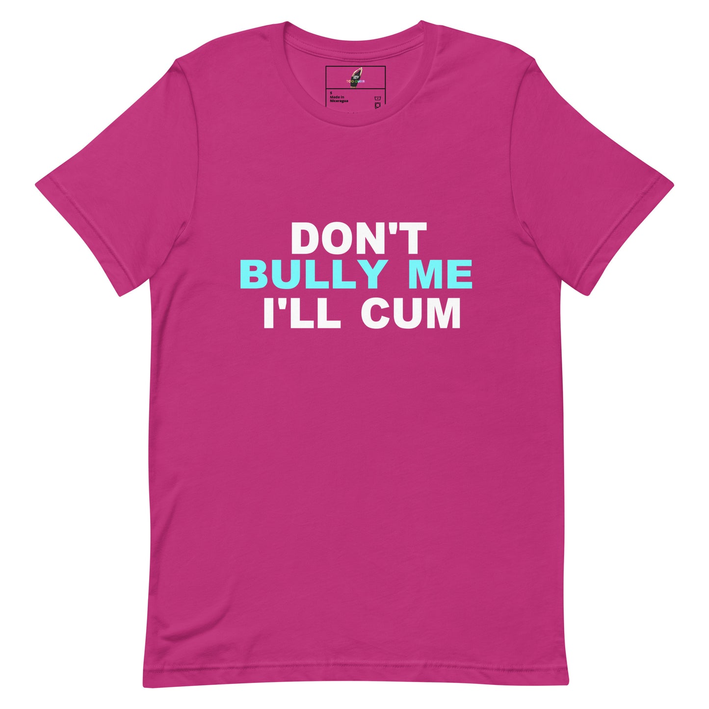 A bright pink short-sleeve t-shirt with the text 'DON'T BULLY ME I'LL CUM' printed on the chest in white and light blue, displayed on a clean white background.