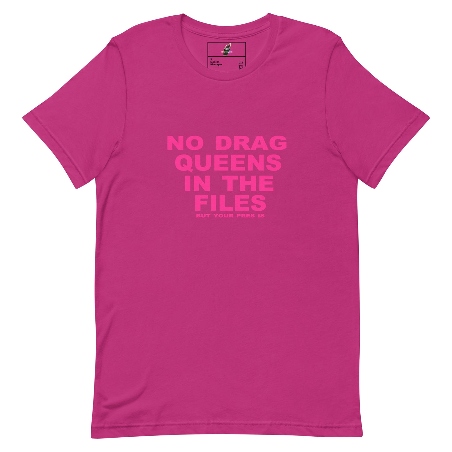 A bright pink short-sleeve t-shirt with the slogan 'NO DRAG QUEENS IN THE FILES' printed in a slightly darker pink font on the chest, displayed on a clean white background.