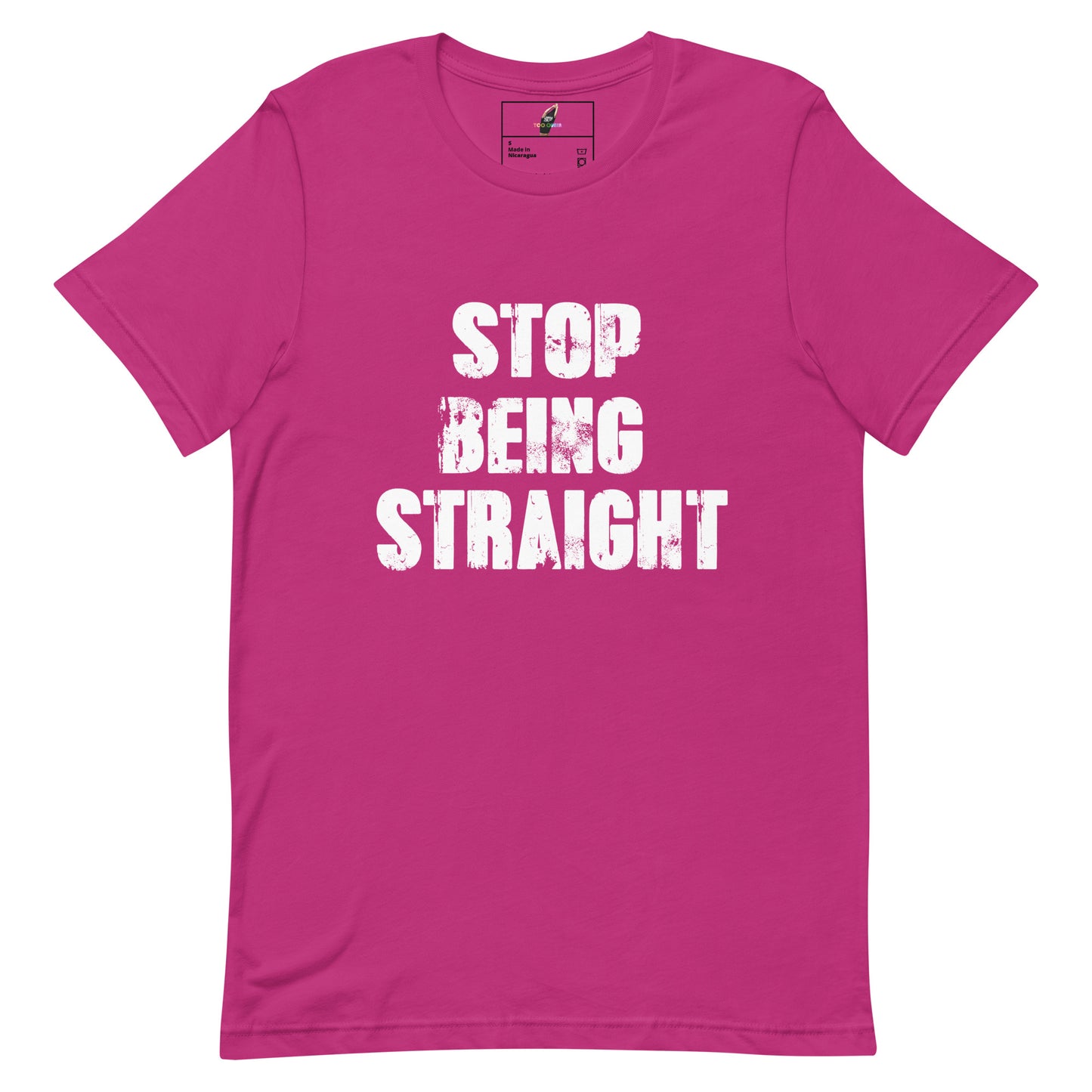 A bright pink short-sleeve t-shirt with the phrase 'STOP BEING STRAIGHT' printed in distressed white block letters across the chest, displayed on a clean white background.