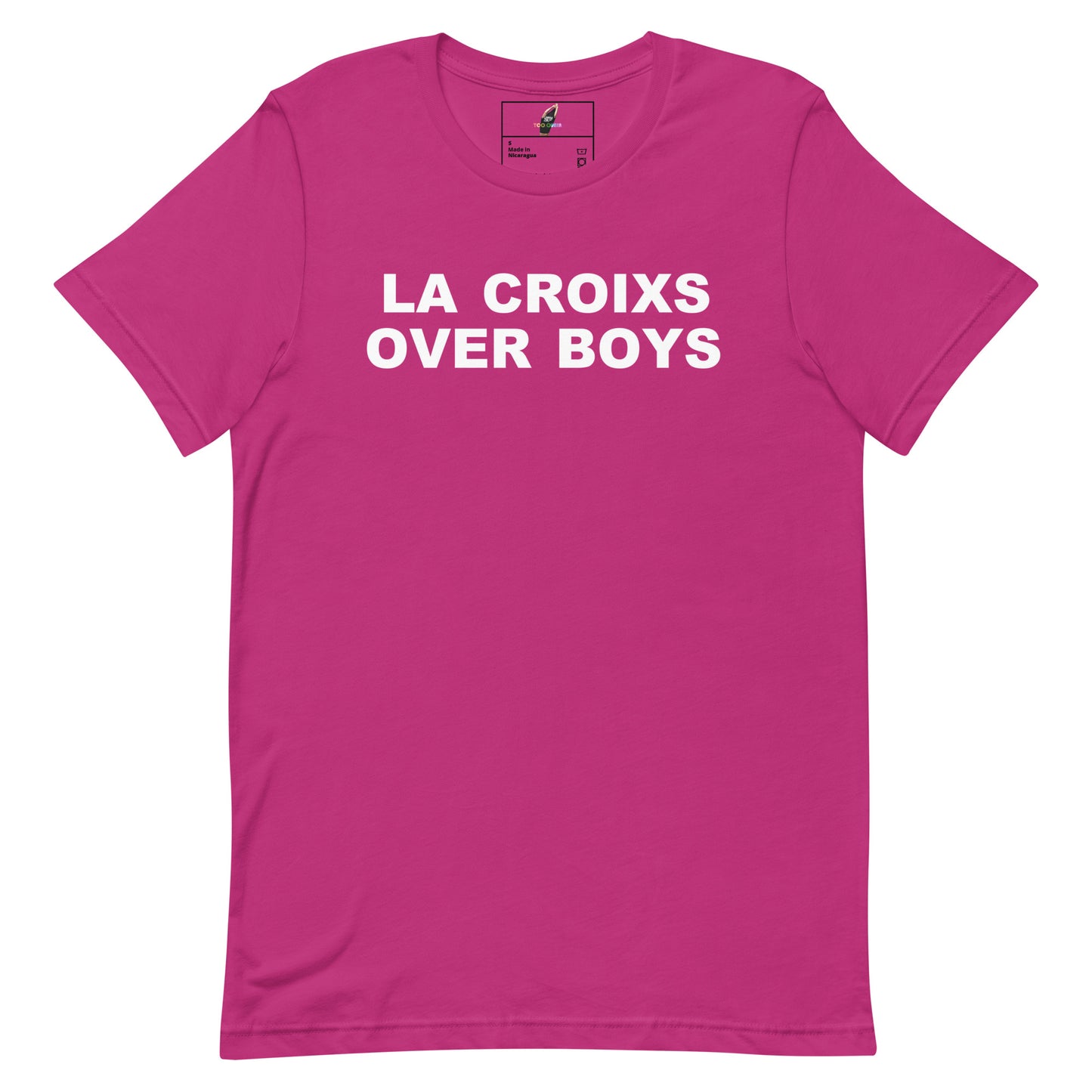 A bright pink short-sleeve crewneck t-shirt with the phrase 'LA CROIXS OVER BOYS' printed in bold white capital letters across the chest, displayed on a clean white background.