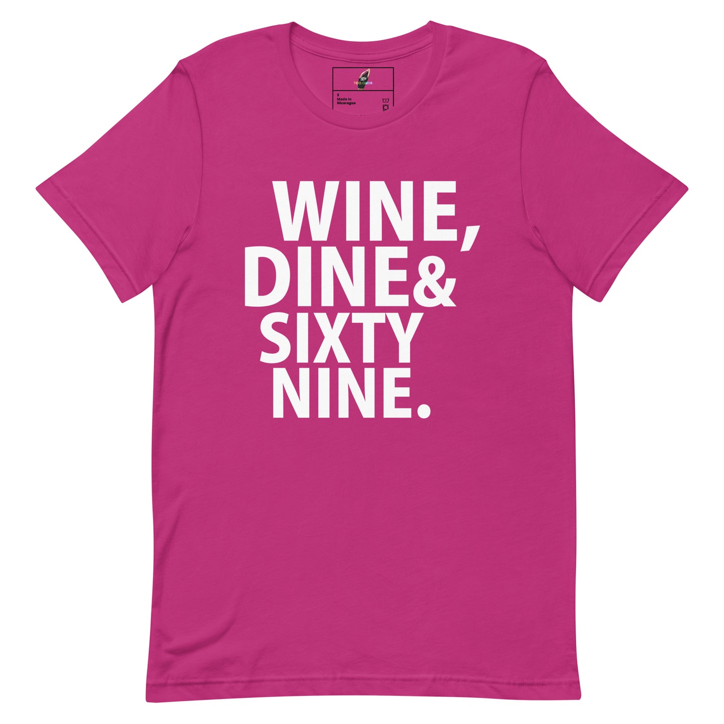 A bright pink short-sleeve t-shirt with bold white text on the front reading 'WINE, DINE & SIXTY NINE.' against a plain white background.