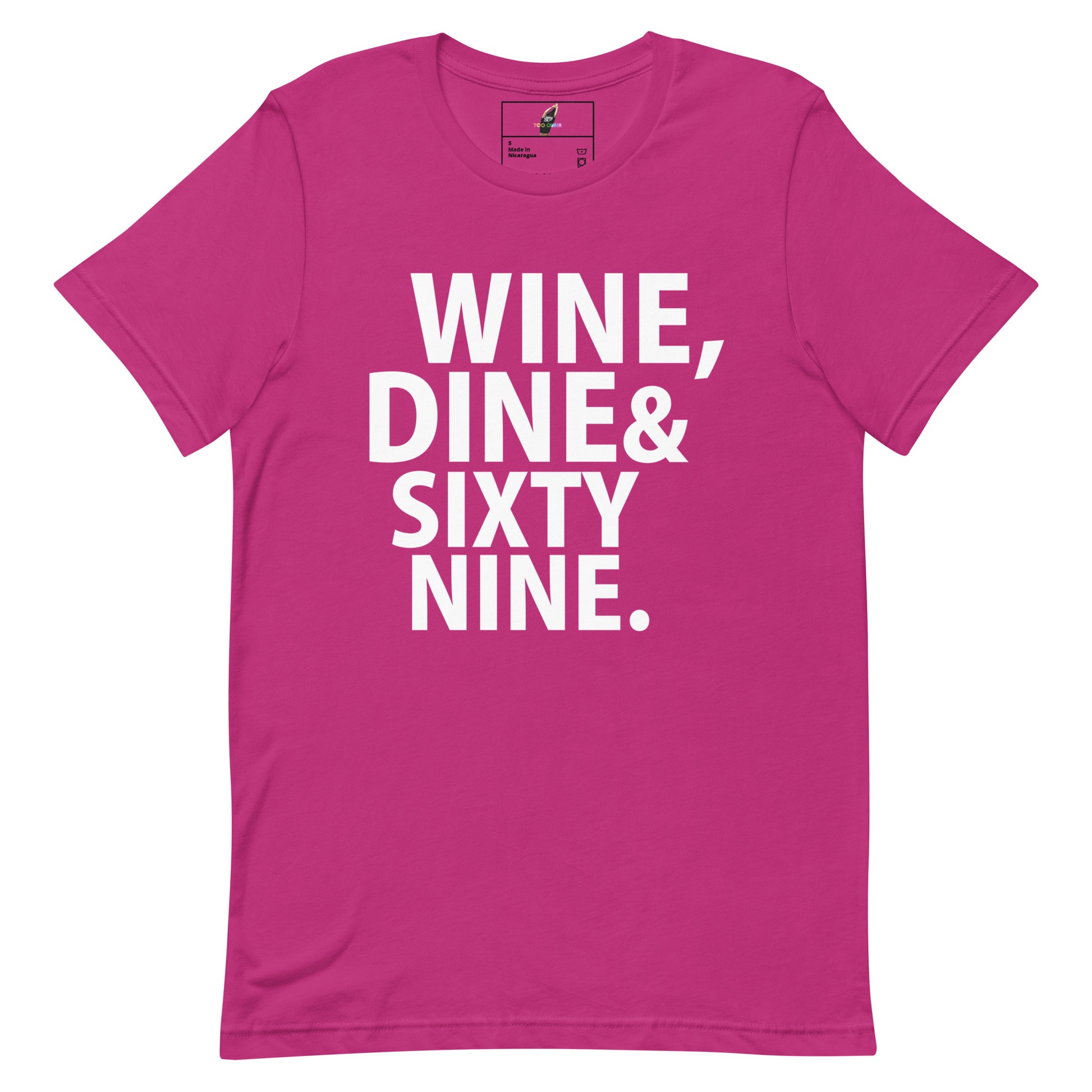 A bright pink short-sleeve t-shirt with bold white text on the front reading 'WINE, DINE & SIXTY NINE.' against a plain white background.