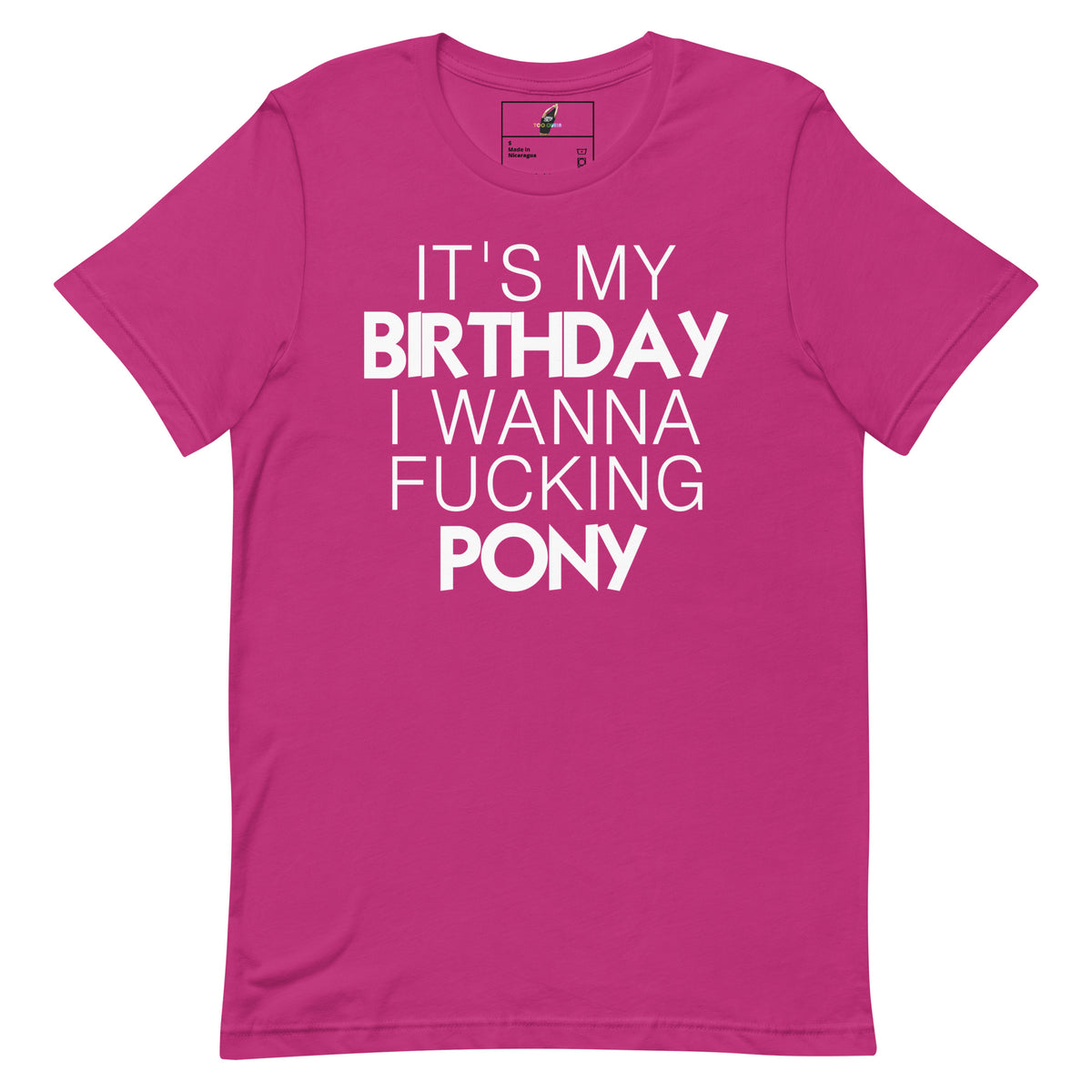 A bright pink short-sleeve t-shirt with bold white text on the front that reads 'IT'S MY BIRTHDAY I WANNA FUCKING PONY'.