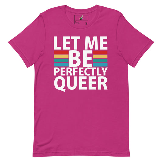 A bright pink short-sleeve t-shirt with a graphic on the front that reads 'LET ME BE PERFECTLY QUEER' in bold white letters, with a rainbow stripe graphic behind the word 'BE'.