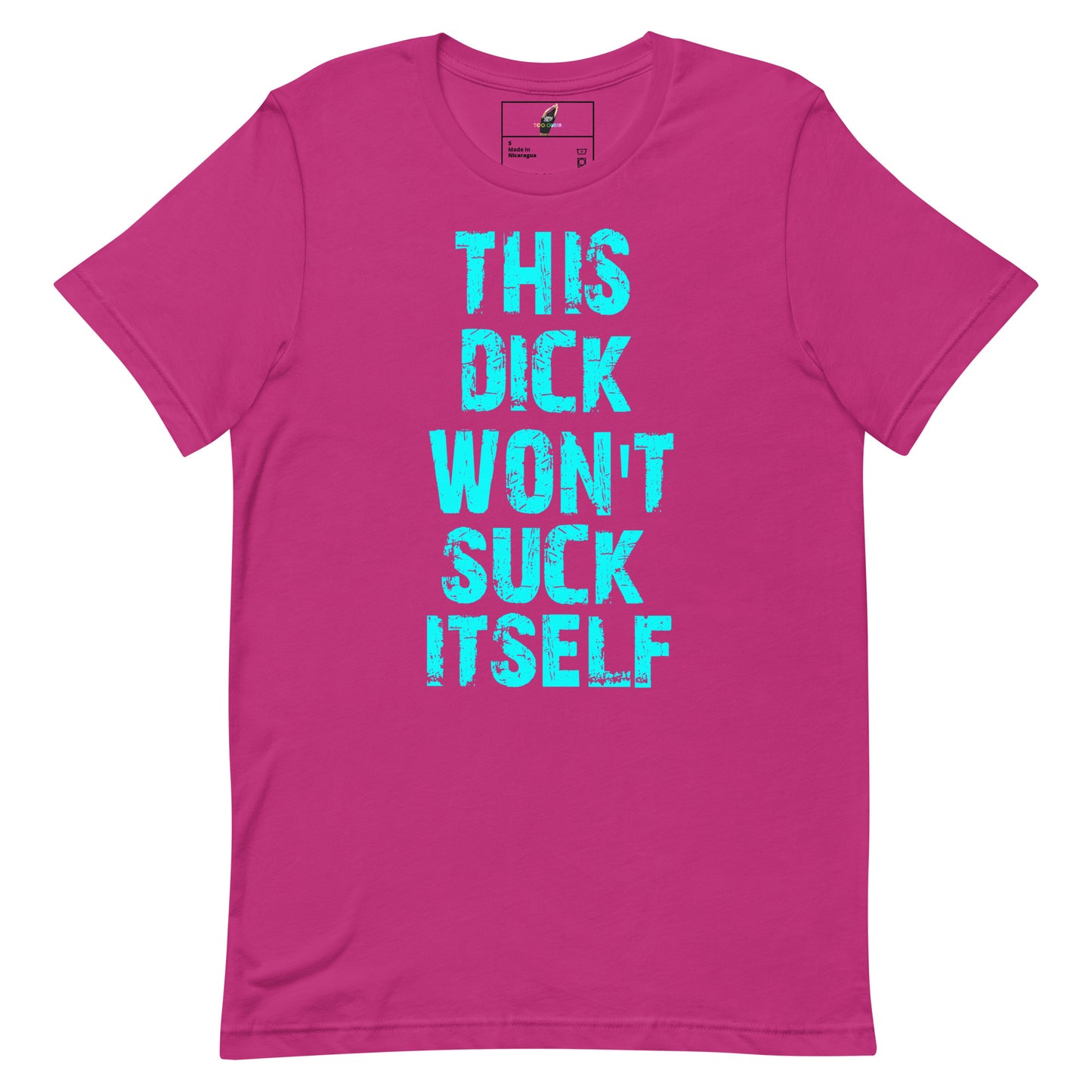 A bright pink short-sleeve t-shirt with the phrase 'THIS DICK WON'T SUCK ITSELF' printed vertically in a distressed turquoise font on the front.