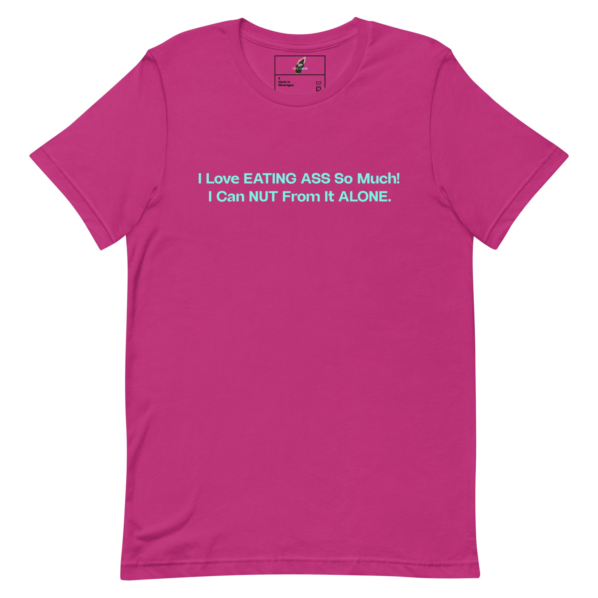 A bright pink short-sleeve t-shirt with a light blue text graphic on the chest that reads, 'I Love EATING ASS So Much! I Can NUT From It ALONE.'.