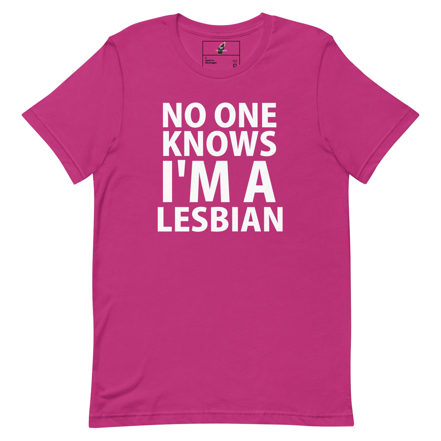 A bright pink short-sleeve t-shirt with bold white text on the front reading 'NO ONE KNOWS I'M A LESBIAN'.