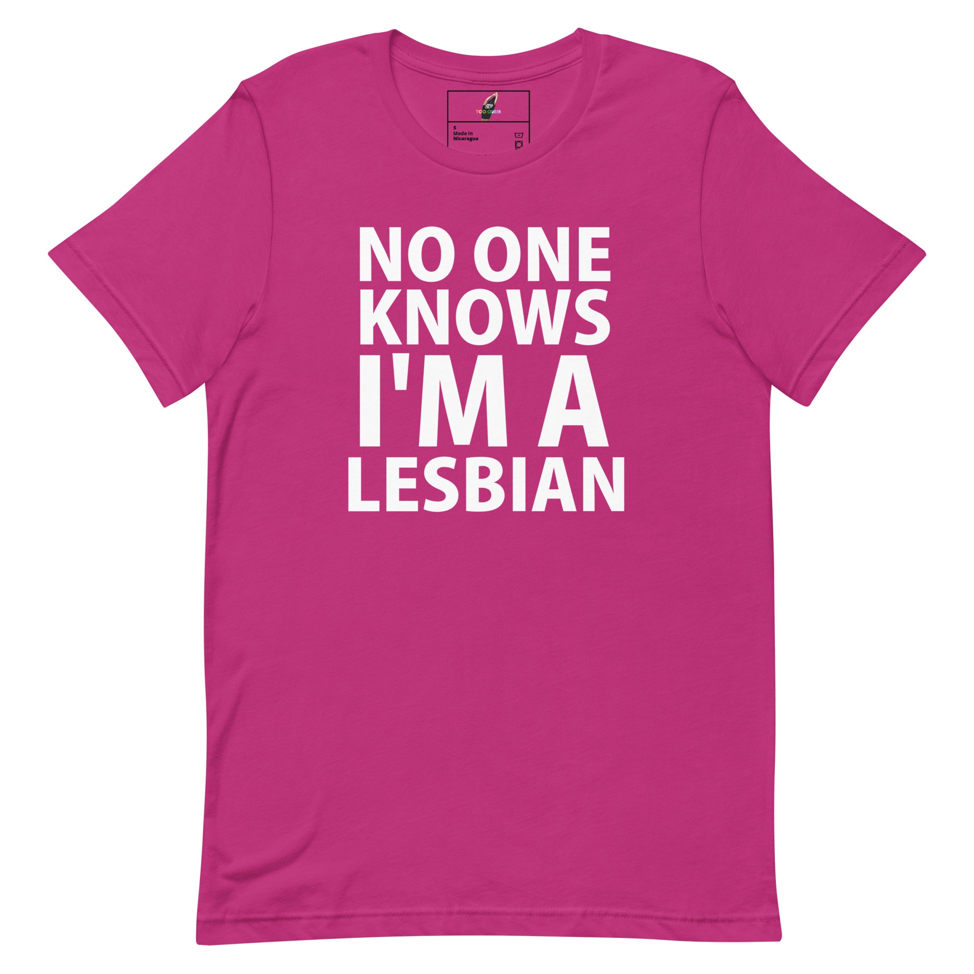 A bright pink short-sleeve t-shirt with bold white text on the front reading 'NO ONE KNOWS I'M A LESBIAN'.