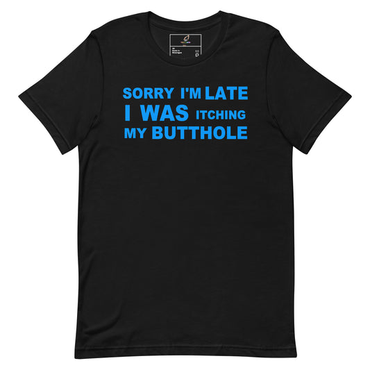 A black short-sleeve crewneck t-shirt with a bold blue text graphic on the chest that reads 'SORRY I'M LATE I WAS ITCHING MY BUTTHOLE'.