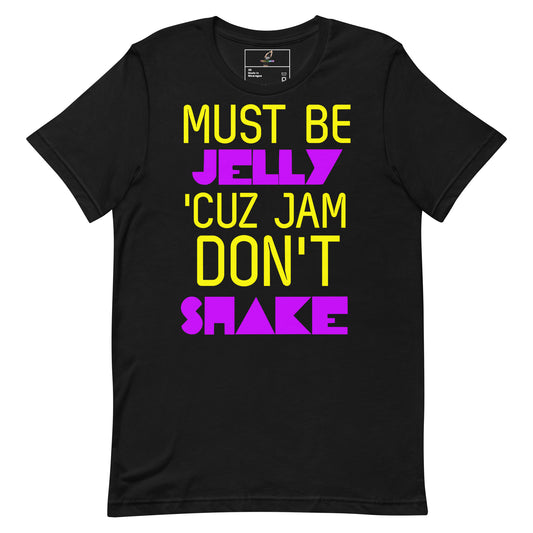 A black short-sleeve t-shirt with a bold graphic text print reading 'MUST BE JELLY 'CUZ JAM DON'T SHAKE' in yellow and purple lettering, displayed on a solid white background.