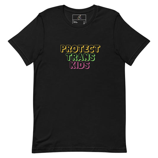 A black short-sleeve crewneck t-shirt featuring the text 'PROTECT TRANS KIDS' printed on the chest in yellow, green, and pink outlined lettering, displayed against a solid white background.