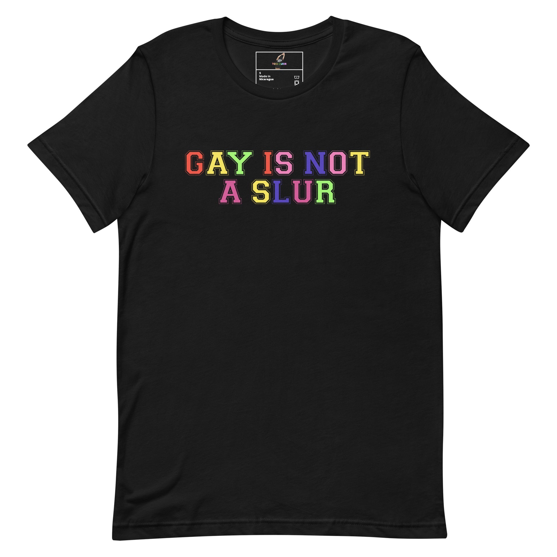 A black short-sleeve crewneck t-shirt featuring the text 'GAY IS NOT A SLUR' printed across the chest in a vibrant rainbow gradient font.