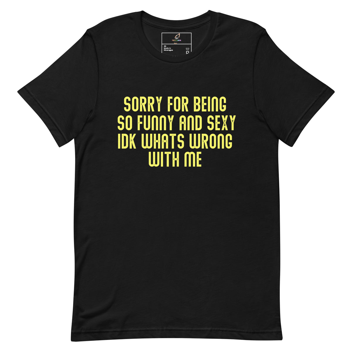 A black short-sleeve crewneck t-shirt with bold yellow text on the front reading 'SORRY FOR BEING SO FUNNY AND SEXY IDK WHATS WRONG WITH ME'.