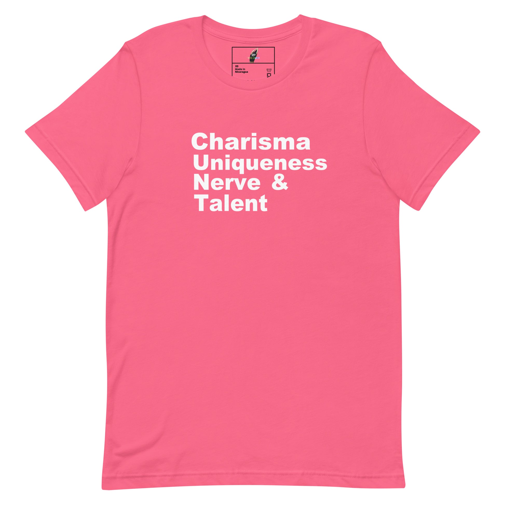 A pink short-sleeve crewneck t-shirt with the words 'Charisma Uniqueness Nerve & Talent' printed in white sans-serif text across the chest, displayed on a clean white background.