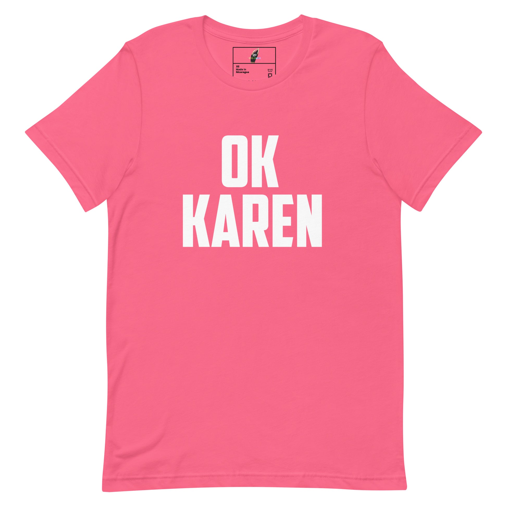 A bright pink short-sleeve crewneck t-shirt with the words 'OK KAREN' printed in bold white capital letters across the chest, displayed flat against a solid white background.