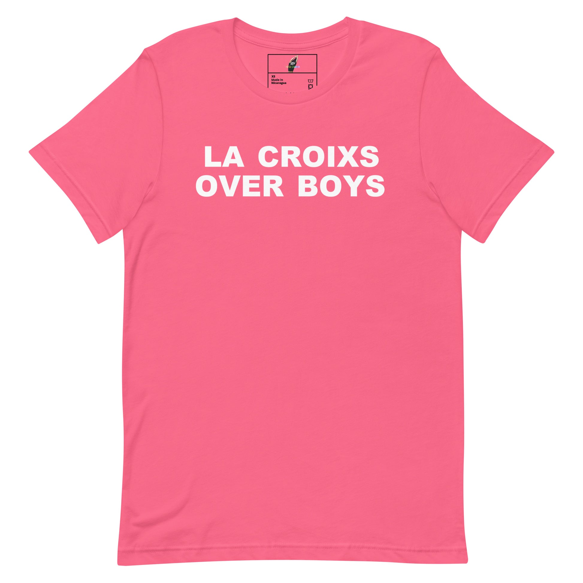 A bright pink short-sleeve t-shirt with the phrase 'LA CROIXS OVER BOYS' printed in bold white capital letters across the chest, displayed flat against a solid white background.