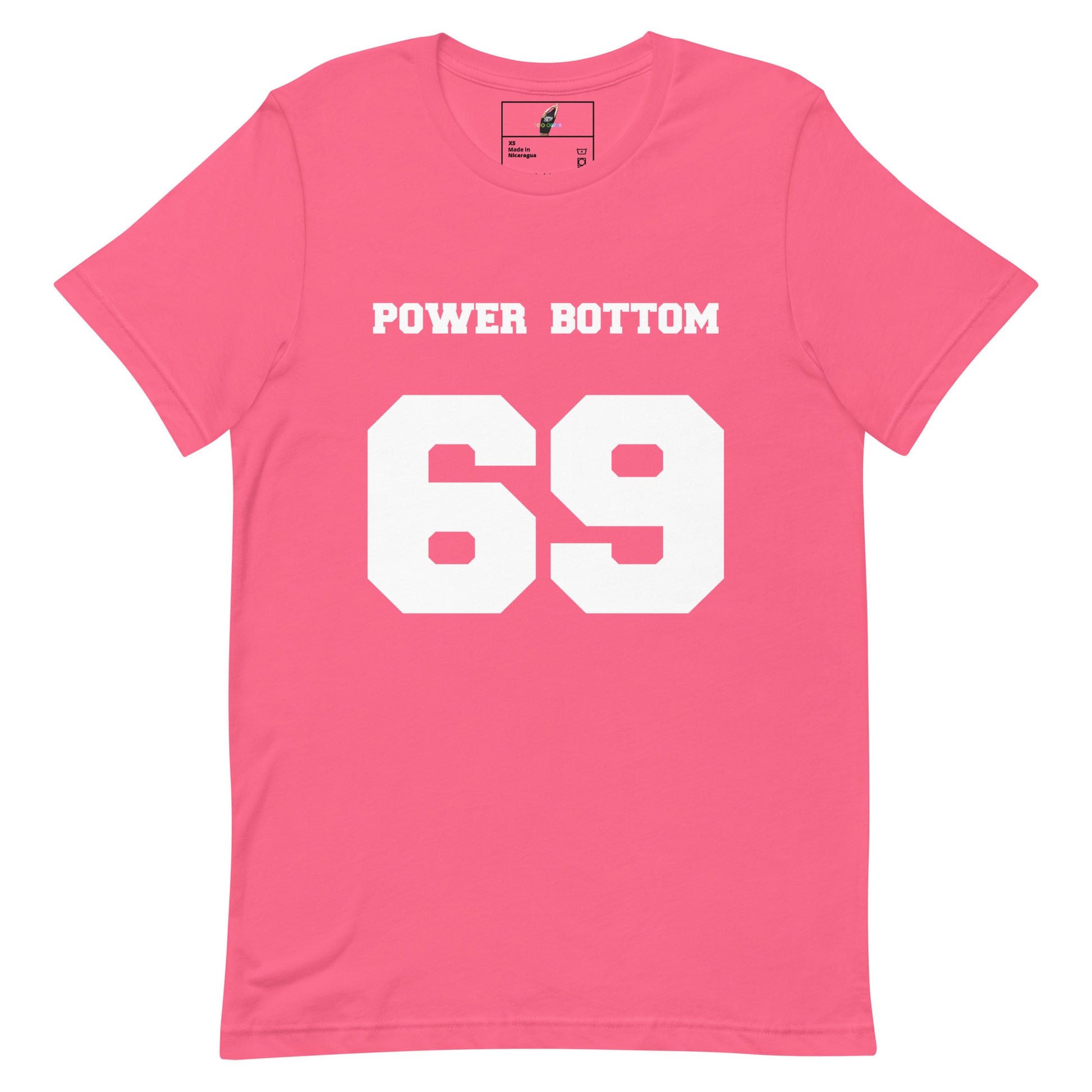 A pink short-sleeve crewneck t-shirt with 'POWER BOTTOM' printed in white block letters above the large white number '69' on the front, shown on a plain white background.